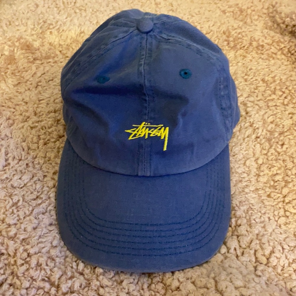 Blue Stussy hat.